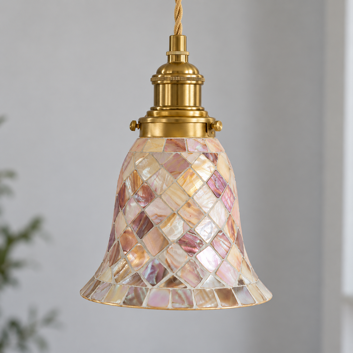 Close-up of model B pendant's pearly shell mosaic and copper socket fittings