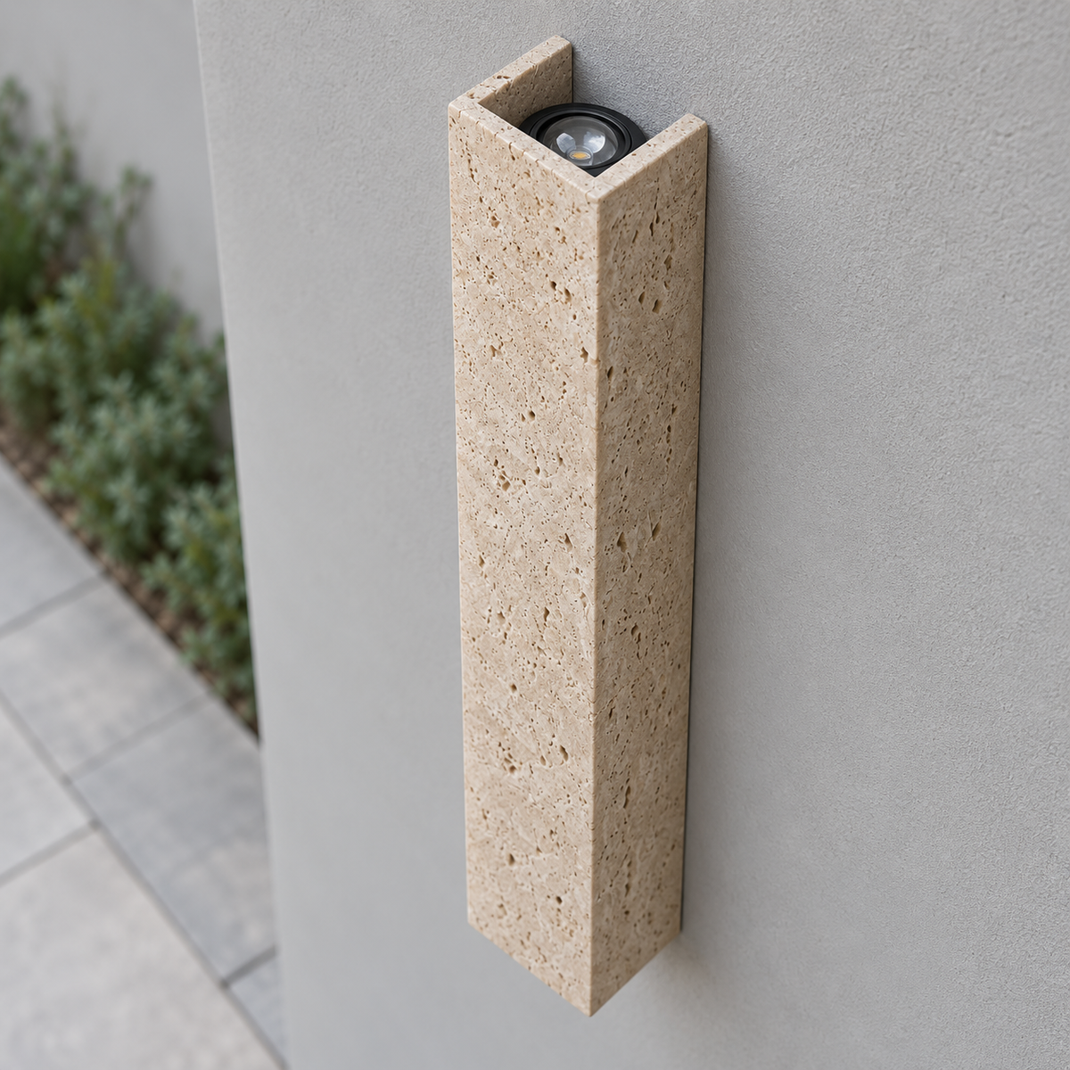 60 cm travertine wall light seen from above with its upper recessed COB optic