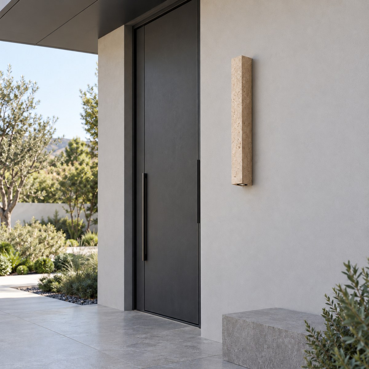 80 cm travertine wall light beside a modern covered entrance, switched off