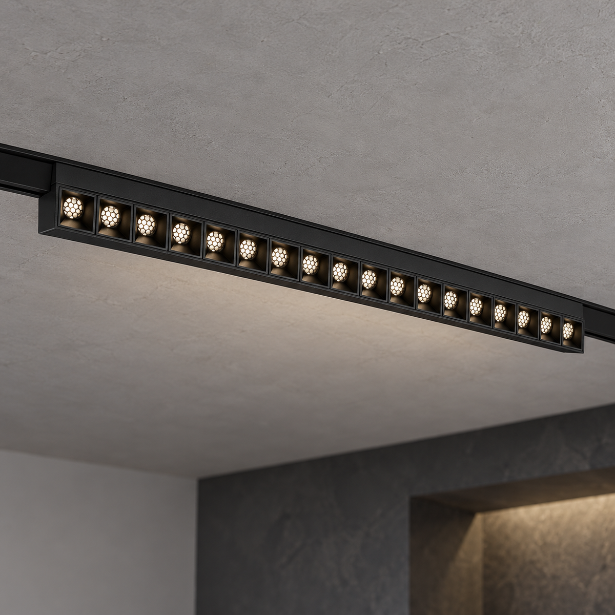 Magnetic fixed grille light 18W, black finish, with eighteen illuminated recessed honeycomb optics, installed in a ceiling track.