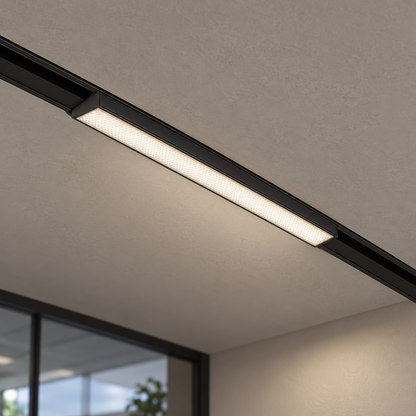 Magnetic linear floodlight 12W, black finish, illuminated and mounted in a continuous ceiling track with visible room context.