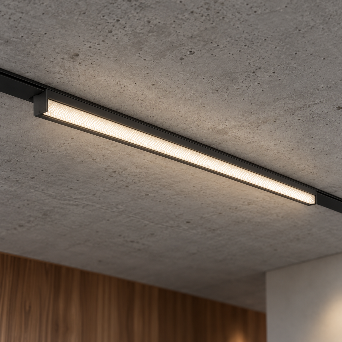 Magnetic linear floodlight 24W, black finish, illuminated and installed in a ceiling rail with natural room context.