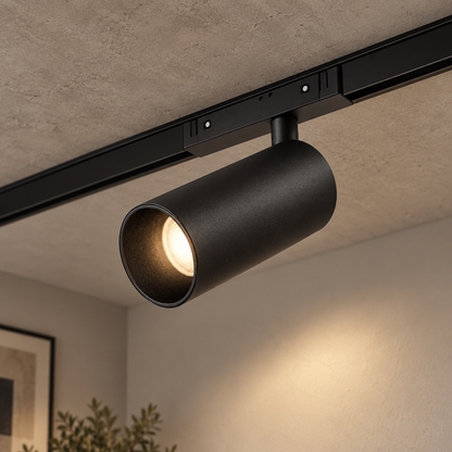 Magnetic track Spotlight 24W, black finish, illuminated and installed on a ceiling track in a room.