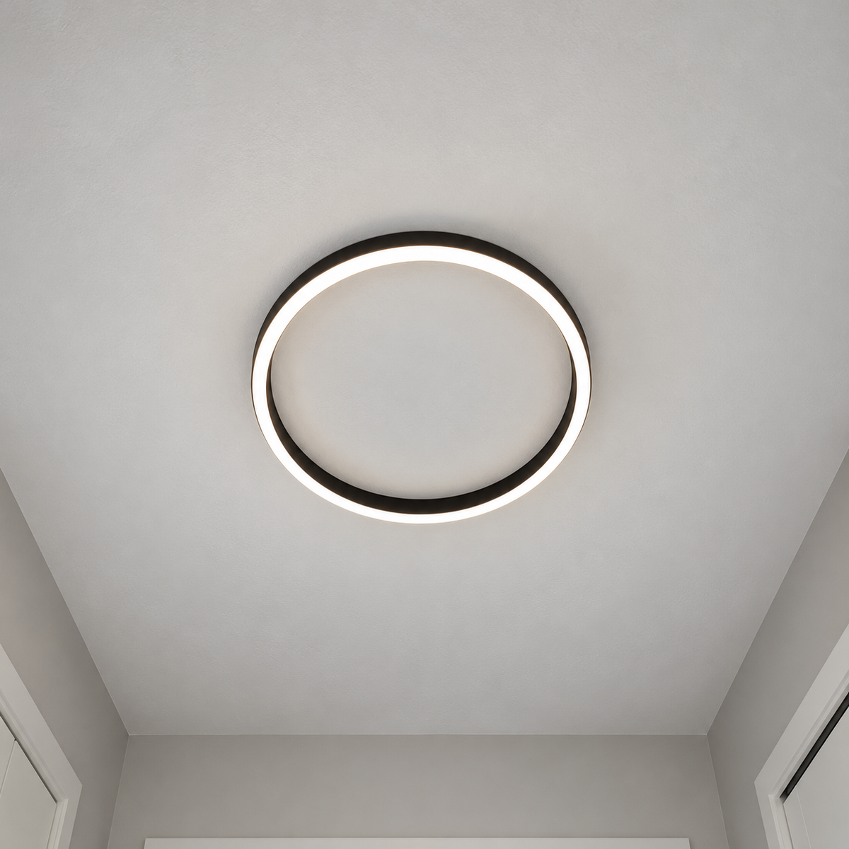 Black open-center LED ceiling light viewed directly from underneath