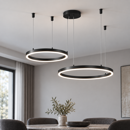 Black suspended LED chandelier with two offset horizontal rings, 30 and 40 cm, in a neutral dining room