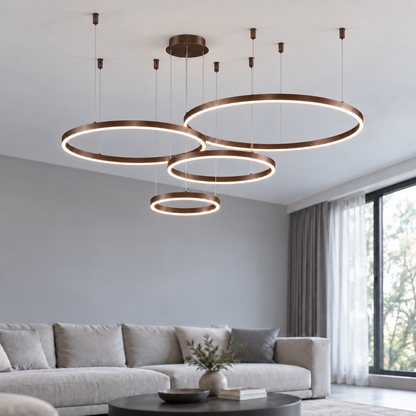 Coffee suspended LED ring chandelier with four offset horizontal rings, 40, 60, 80 and 100 cm diameters, illuminated in a neutral modern living room.