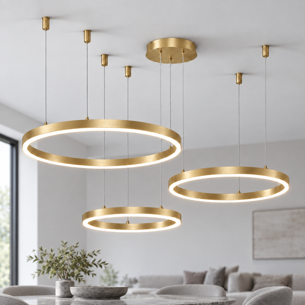 Gold suspended LED chandelier with three horizontal rings in 60, 80 and 100 cm diameters.
