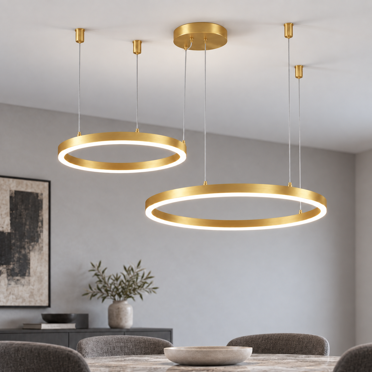 Gold suspended LED chandelier with two offset horizontal rings, 40 and 60 cm, in a neutral dining room