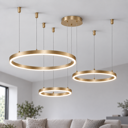 Gold suspended LED chandelier with three horizontal rings in 30, 40 and 60 cm diameters.