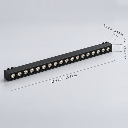 Black grille light 18w with dimension lines in centimetres and inches: Body length 33.8 cm / 13.31 in; Body width 2.6 cm / 1.02 in; Body height excluding contacts 2.4 cm / 0.94 in.