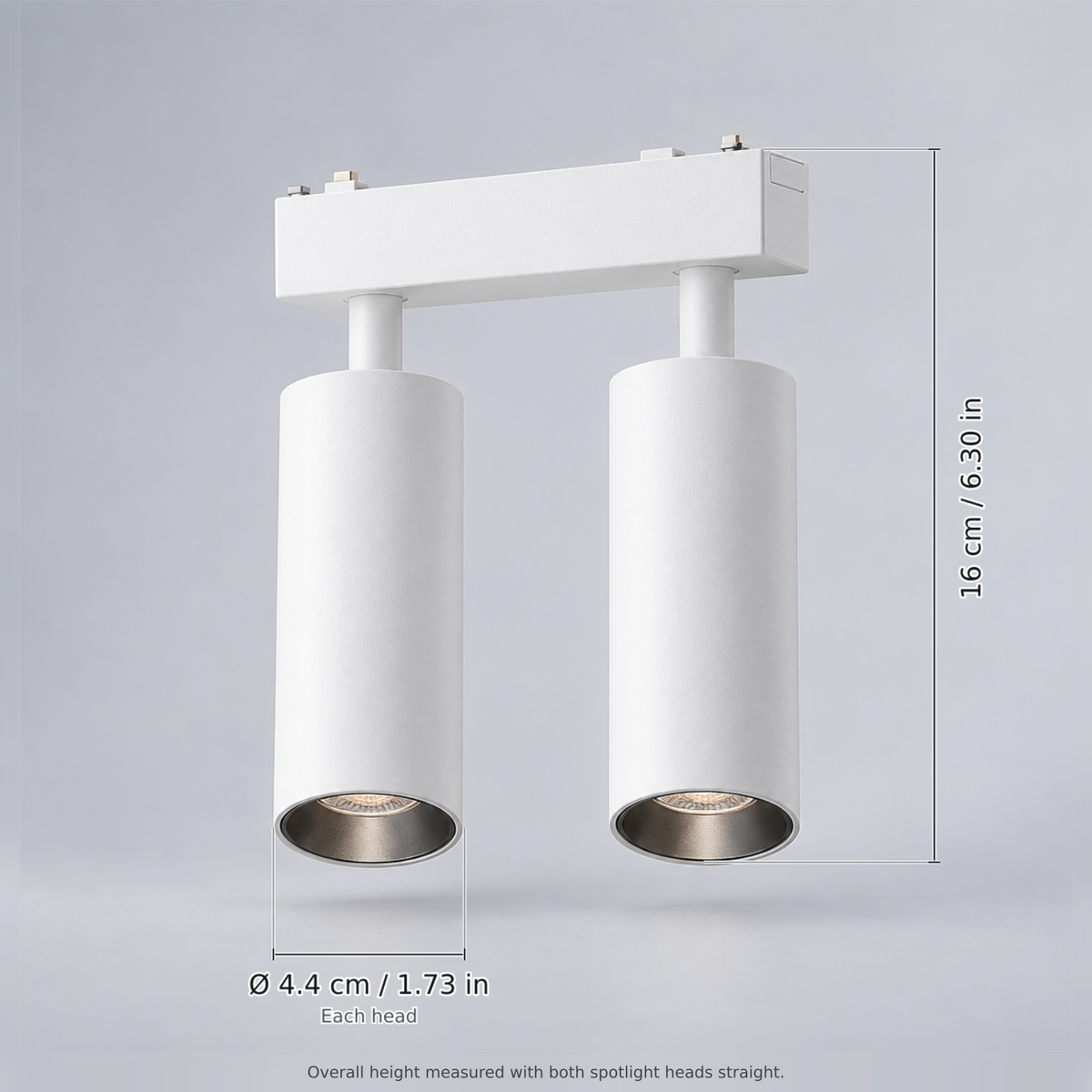 White double spotlight 18w with dimension lines in centimetres and inches: Overall height (heads straight) 16 cm / 6.30 in; Each head Ø 4.4 cm / 1.73 in.