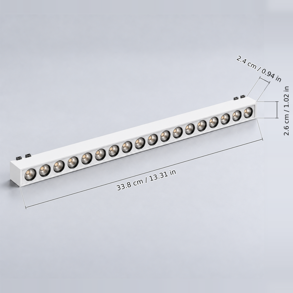 White grille light 18w with dimension lines in centimetres and inches: Body length 33.8 cm / 13.31 in; Body width 2.6 cm / 1.02 in; Body height excluding contacts 2.4 cm / 0.94 in.