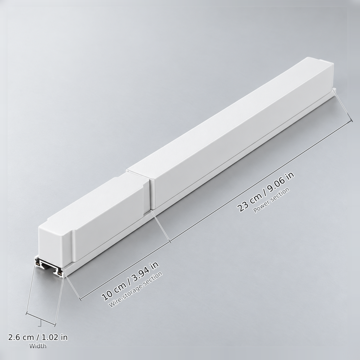 White length 33 cm (driver 150w, 110v) with dimension lines in centimetres and inches: Wire-storage section 10 cm / 3.94 in; Power section 23 cm / 9.06 in; Width 2.6 cm / 1.02 in.