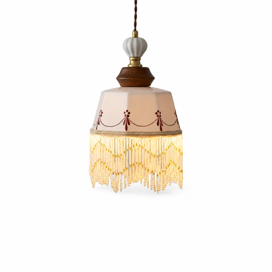 Copper wood pendant with white ceramic tassel on a clean white background