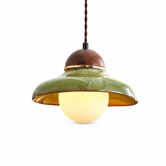 Green ceramic bowl pendant light for kitchen island on a clean white background